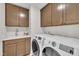 A laundry room with a sink and washer and dryer at 2721 Jazzy St, New Hill, NC 27562