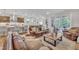 Inviting living room with a view of the kitchen, dining, and outdoor space at 2721 Jazzy St, New Hill, NC 27562