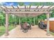 Covered pergola with dining set and barbecue grill at 2721 Jazzy St, New Hill, NC 27562