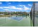 Community pickleball court on a sunny day, with a black chain link fence around it at 2721 Jazzy St, New Hill, NC 27562
