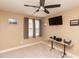 Bedroom featuring a ceiling fan, neutral walls, carpet, and a window with elegant curtains and a wall-mounted TV at 30 Cole Creek Way, Franklinton, NC 27525