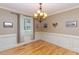 Bright dining room with chandelier and wainscoting at 30 Cole Creek Way, Franklinton, NC 27525