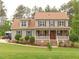 Classic two-story home with manicured lawn, stone accents, and inviting front porch at 30 Cole Creek Way, Franklinton, NC 27525