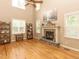 Inviting living room featuring large windows, high ceilings and a fireplace at 30 Cole Creek Way, Franklinton, NC 27525
