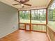 Relaxing screened porch with wood flooring and view of large backyard at 30 Cole Creek Way, Franklinton, NC 27525