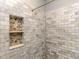 Close-up showcasing a tiled shower niche and elegant marble tiling, adding a touch of luxury to the bathroom at 30 Cole Creek Way, Franklinton, NC 27525