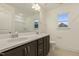 Modern bathroom featuring double vanity, large mirror, and tiled floor at 304 Ford Meadows Dr, Garner, NC 27529