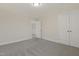 This carpeted bedroom features neutral walls, white trim, and a double-door closet at 304 Ford Meadows Dr, Garner, NC 27529