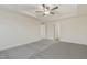 Open bedroom with tray ceiling and adjacent doorway at 304 Ford Meadows Dr, Garner, NC 27529