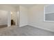 Cozy bedroom with carpet, a closet and adjacent bathroom offering comfort and convenience at 304 Ford Meadows Dr, Garner, NC 27529