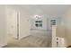 Large, open bonus room with carpet and natural light from many windows at 304 Ford Meadows Dr, Garner, NC 27529