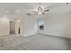 Spacious carpeted bonus room with a ceiling fan and view into an adjacent bathroom at 304 Ford Meadows Dr, Garner, NC 27529