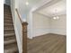 Bright dining area featuring elegant trim, hardwood floors, and stylish chandelier lighting at 304 Ford Meadows Dr, Garner, NC 27529