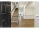 Welcoming foyer boasts hardwood floors, staircase, and an open floor plan with contemporary finishes at 304 Ford Meadows Dr, Garner, NC 27529