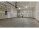 Large two-car garage, showing unfinished drywall, concrete floor and hot water heater at 304 Ford Meadows Dr, Garner, NC 27529