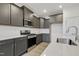 Updated kitchen showcasing stainless steel appliances, stone countertops and modern cabinetry at 304 Ford Meadows Dr, Garner, NC 27529