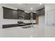 Well-appointed kitchen featuring stone countertops, a stainless steel stove, and ample cabinet space at 304 Ford Meadows Dr, Garner, NC 27529