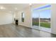 Living room features neutral walls, fireplace and a sliding glass door leading to the outdoor area at 304 Ford Meadows Dr, Garner, NC 27529