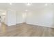 This expansive living area has plenty of natural light and stylish wood grain floors at 304 Ford Meadows Dr, Garner, NC 27529