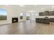 The open floor plan features a fireplace, wood grain floors, and an open kitchen space at 304 Ford Meadows Dr, Garner, NC 27529