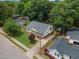 Aerial view of a home with a green lawn, established trees, and manicured landscaping at 304 S Smith St, Clayton, NC 27520