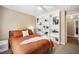 Cozy bedroom with a queen-sized bed and built-in bookshelves to display decorative items at 304 S Smith St, Clayton, NC 27520