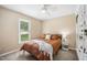 Bedroom featuring a bed, nightstand, and natural light from the window at 304 S Smith St, Clayton, NC 27520