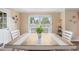 Bright dining area with a table for four and views of the outdoors from the large window at 304 S Smith St, Clayton, NC 27520