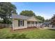 Inviting home with a well-manicured lawn and a classic design at 304 S Smith St, Clayton, NC 27520