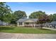 Charming single-story home with a welcoming front porch and a beautifully landscaped yard at 304 S Smith St, Clayton, NC 27520