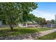 Single-story home with a welcoming front porch and a lush green lawn at 304 S Smith St, Clayton, NC 27520