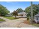 Charming single-story home boasting a cozy front porch and a beautifully landscaped front yard at 304 S Smith St, Clayton, NC 27520