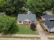 Aerial view of home featuring a green lawn, front porch, and mature landscaping at 304 S Smith St, Clayton, NC 27520