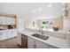 Bright and open kitchen features ample countertop space and stainless steel appliances at 304 S Smith St, Clayton, NC 27520