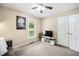 Living room with neutral tones, carpeted floor and a ceiling fan, perfect for relaxation at 304 S Smith St, Clayton, NC 27520
