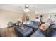 Comfortable living area with a sectional sofa, modern decor, and open access to other rooms at 304 S Smith St, Clayton, NC 27520