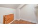 This is an attic space featuring a wood floor and a door at 307 Millbrook Dr, Pittsboro, NC 27312