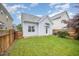Well-maintained backyard with lush green grass and a charming fence for added privacy and curb appeal at 307 Millbrook Dr, Pittsboro, NC 27312