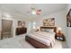 This primary bedroom features a ceiling fan and wooden bedroom furniture set at 307 Millbrook Dr, Pittsboro, NC 27312