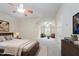 This primary bedroom boasts a large sitting area and a ceiling fan at 307 Millbrook Dr, Pittsboro, NC 27312