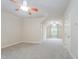 A spacious bedroom features a closet and sitting area with ceiling fans at 307 Millbrook Dr, Pittsboro, NC 27312
