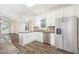 Open-concept kitchen with granite countertops, stainless steel appliances, and a view to the living area at 307 Millbrook Dr, Pittsboro, NC 27312