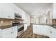 Modern kitchen with stainless steel appliances, granite countertops, and an open layout connecting to living areas at 307 Millbrook Dr, Pittsboro, NC 27312