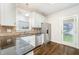 Eat-in kitchen with stainless steel appliances and granite countertops at 307 Millbrook Dr, Pittsboro, NC 27312