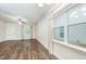 Bright living room with hardwood floors, large windows, and stylish curtains, creating a cozy atmosphere at 307 Millbrook Dr, Pittsboro, NC 27312