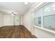 Corner of a living room filled with natural light and hardwood floors at 307 Millbrook Dr, Pittsboro, NC 27312