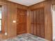 Entryway with wood-paneled walls and a closet at 307 Sunset Dr, Elon, NC 27244