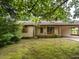 Charming one-story house surrounded by lush trees at 307 Sunset Dr, Elon, NC 27244