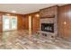 Living room featuring a brick fireplace and french doors at 307 Sunset Dr, Elon, NC 27244