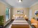 Bright bedroom features large window, neutral walls, and stylish decor at 3116 Kirby St, Durham, NC 27713